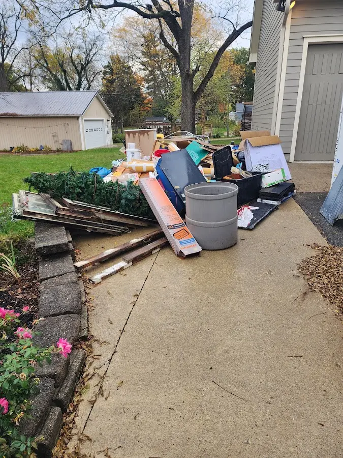 Dumpster being loaded with debris for 3 Yard Dumpster Rental in Wakefield